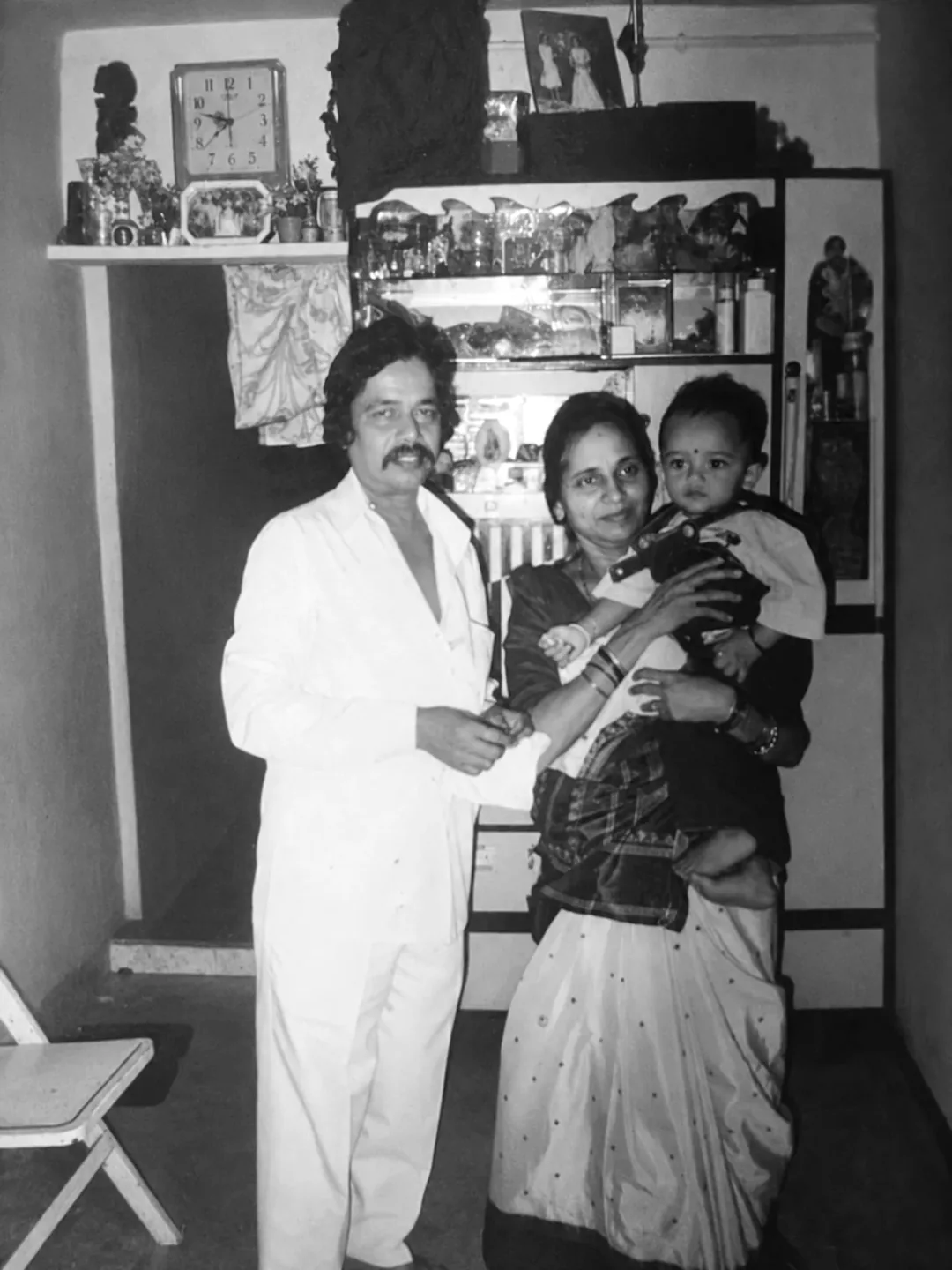 A family portrait at home with a young child