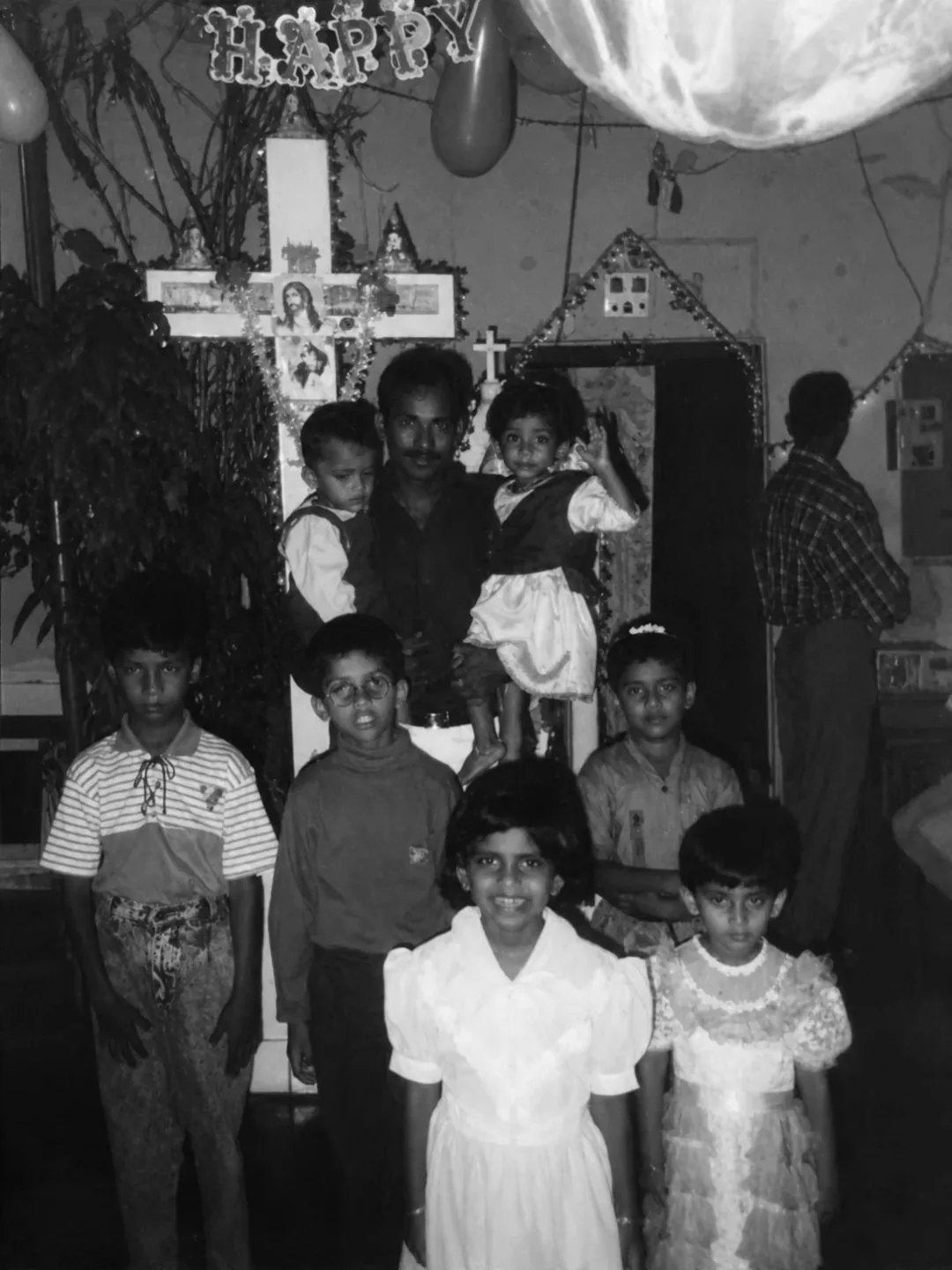 Children and family gathered for a birthday at home